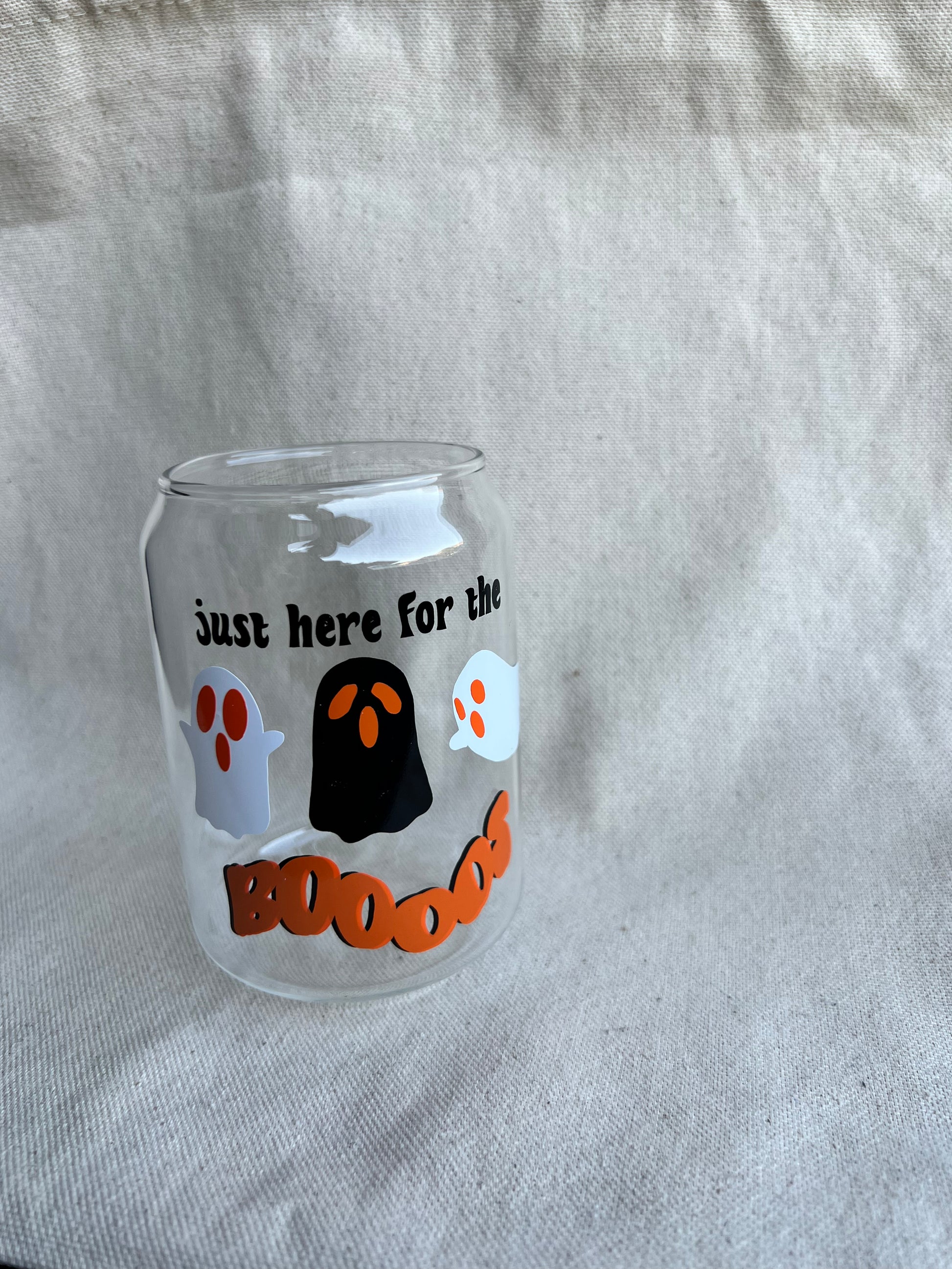 12 oz glass can with halloween design on natural background